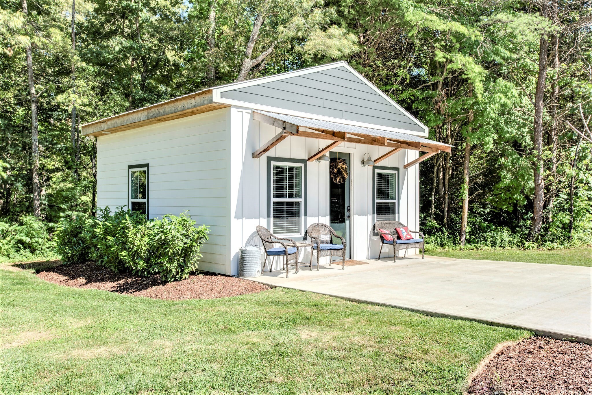 1387 Camp Ravine Road Burns, TN 37029 - Photo 44 of 49 a front view of a house with garden and porch