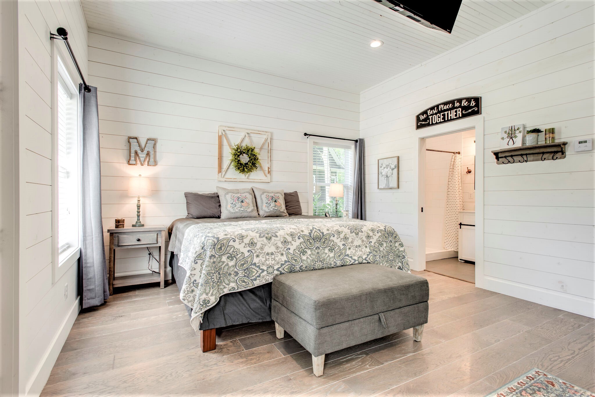 1387 Camp Ravine Road Burns, TN 37029 - Photo 45 of 49 a bedroom with a bed and a painting on the wall