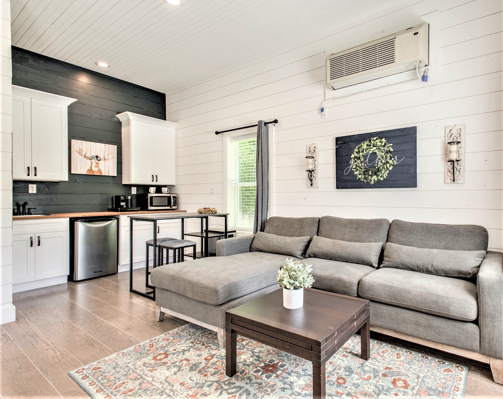 1387 Camp Ravine Road Burns, TN 37029 - Photo 46 of 49 a living room with furniture wooden floor and kitchen view