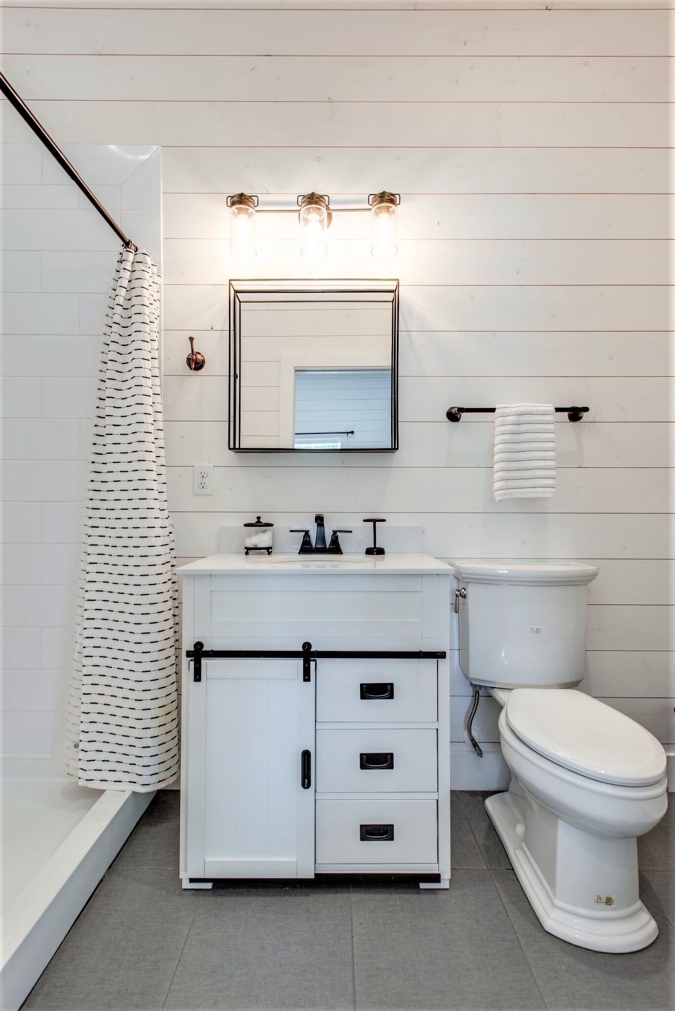 1387 Camp Ravine Road Burns, TN 37029 - Photo 47 of 49 a bathroom with a sink vanity and toilet