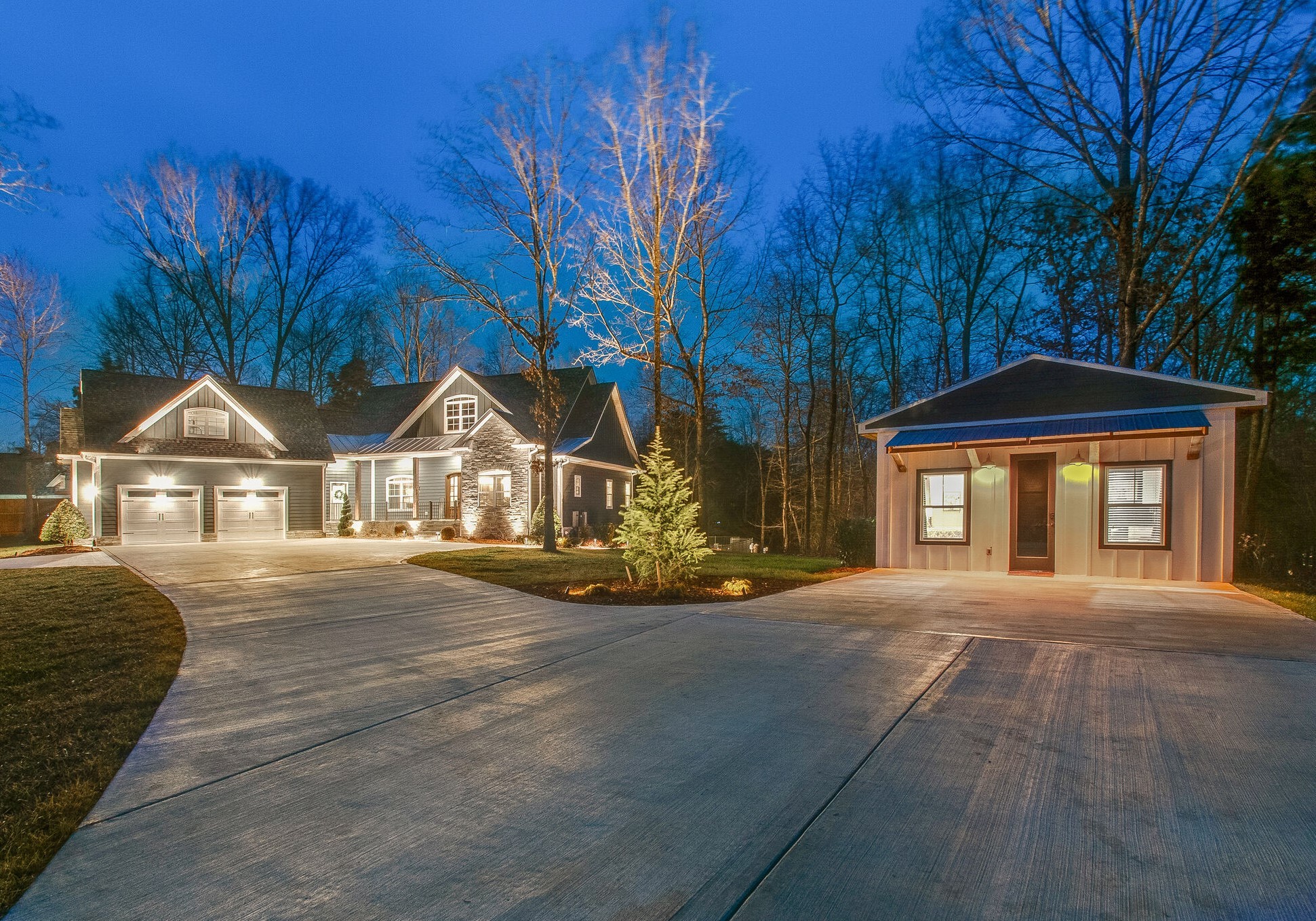 1387 Camp Ravine Road Burns, TN 37029 - Photo 7 of 49 a front view of a house with a yard and garage