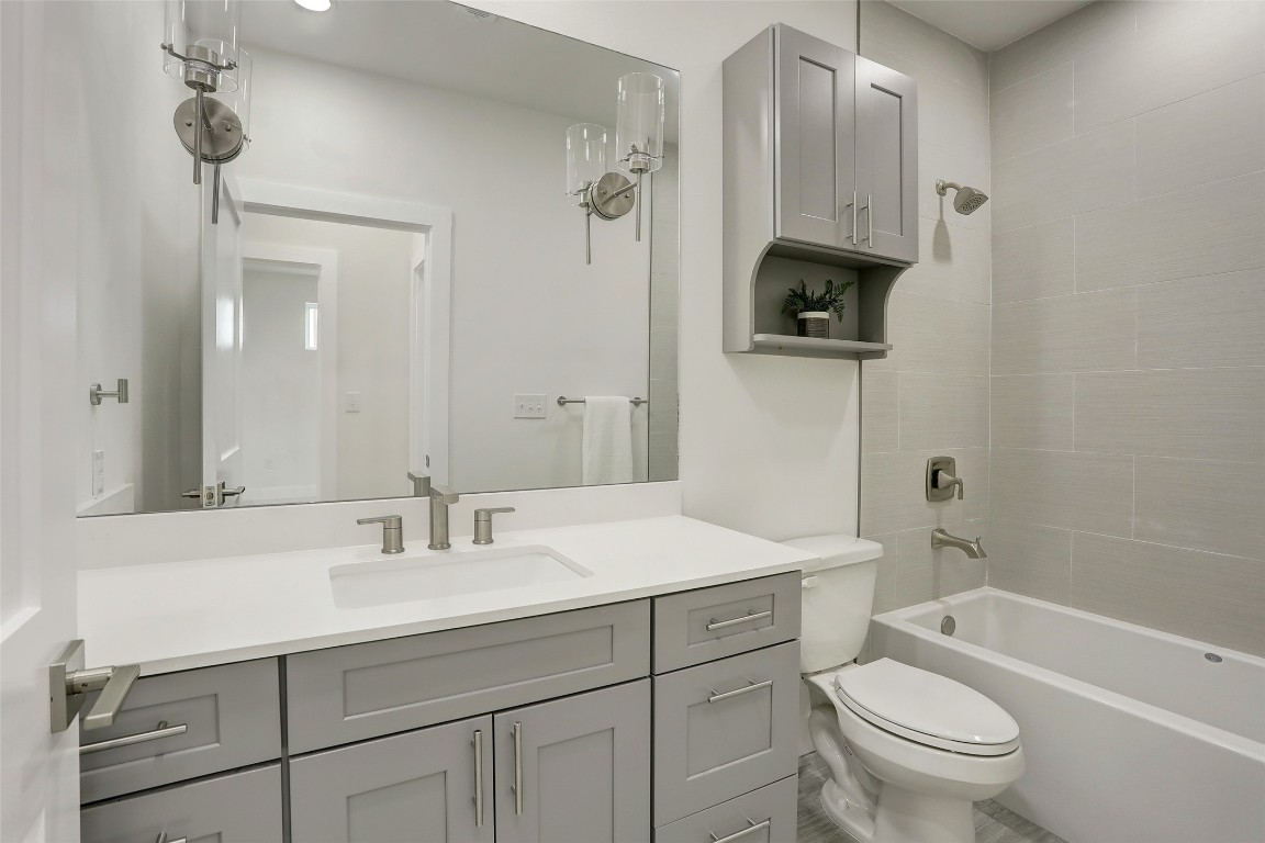 4300 Mansfield Dam Road, Unit 1321 /1331 Austin, TX 78734 - Photo 16 of 31 a bathroom with a sink a toilet and shower