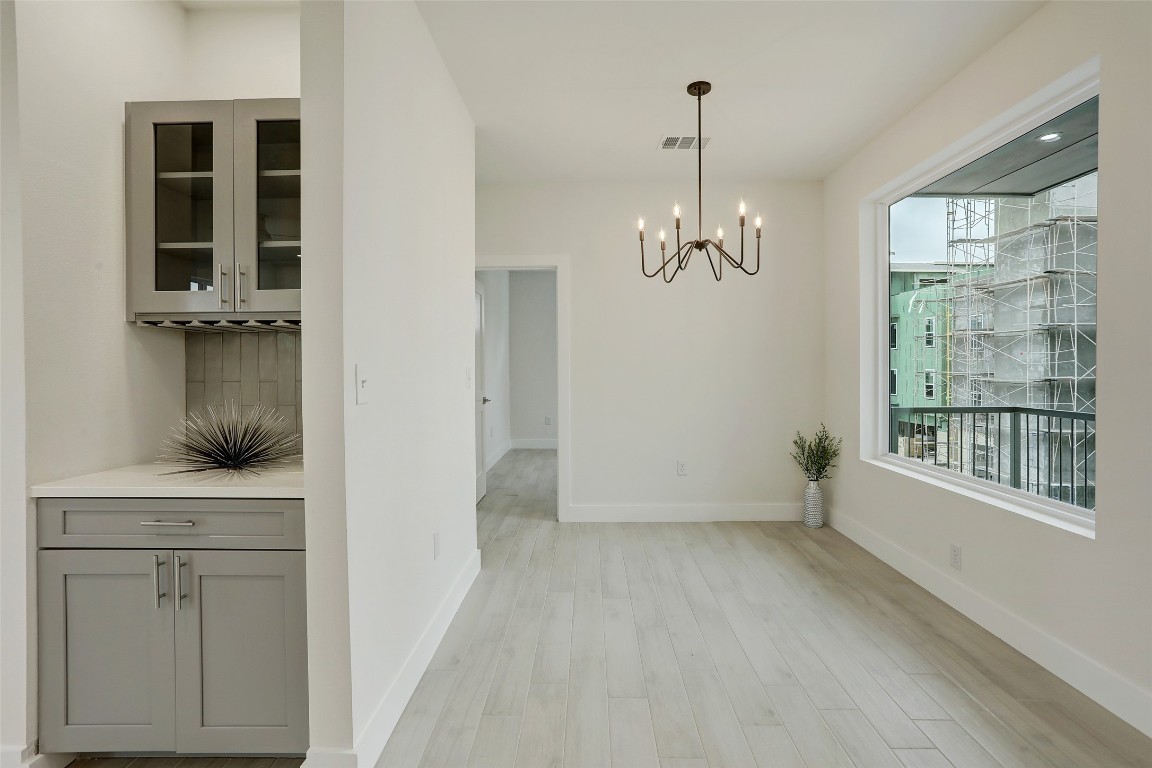 4300 Mansfield Dam Road, Unit 1321 /1331 Austin, TX 78734 - Photo 3 of 31 a view of a room with wooden floor and windows