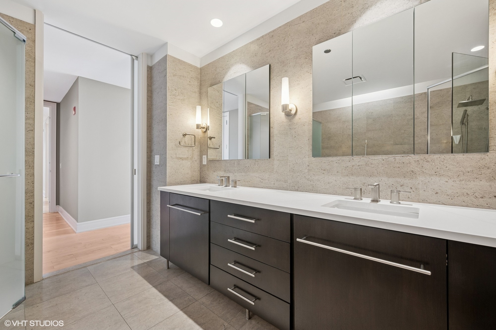 401 North Wabash Avenue, Unit 57F Chicago, IL 60611 - Photo 11 of 45 a bathroom with a sink and a mirror