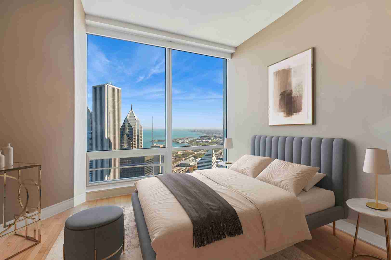 401 North Wabash Avenue, Unit 57F Chicago, IL 60611 - Photo 12 of 45 a bedroom with a bed and a large window