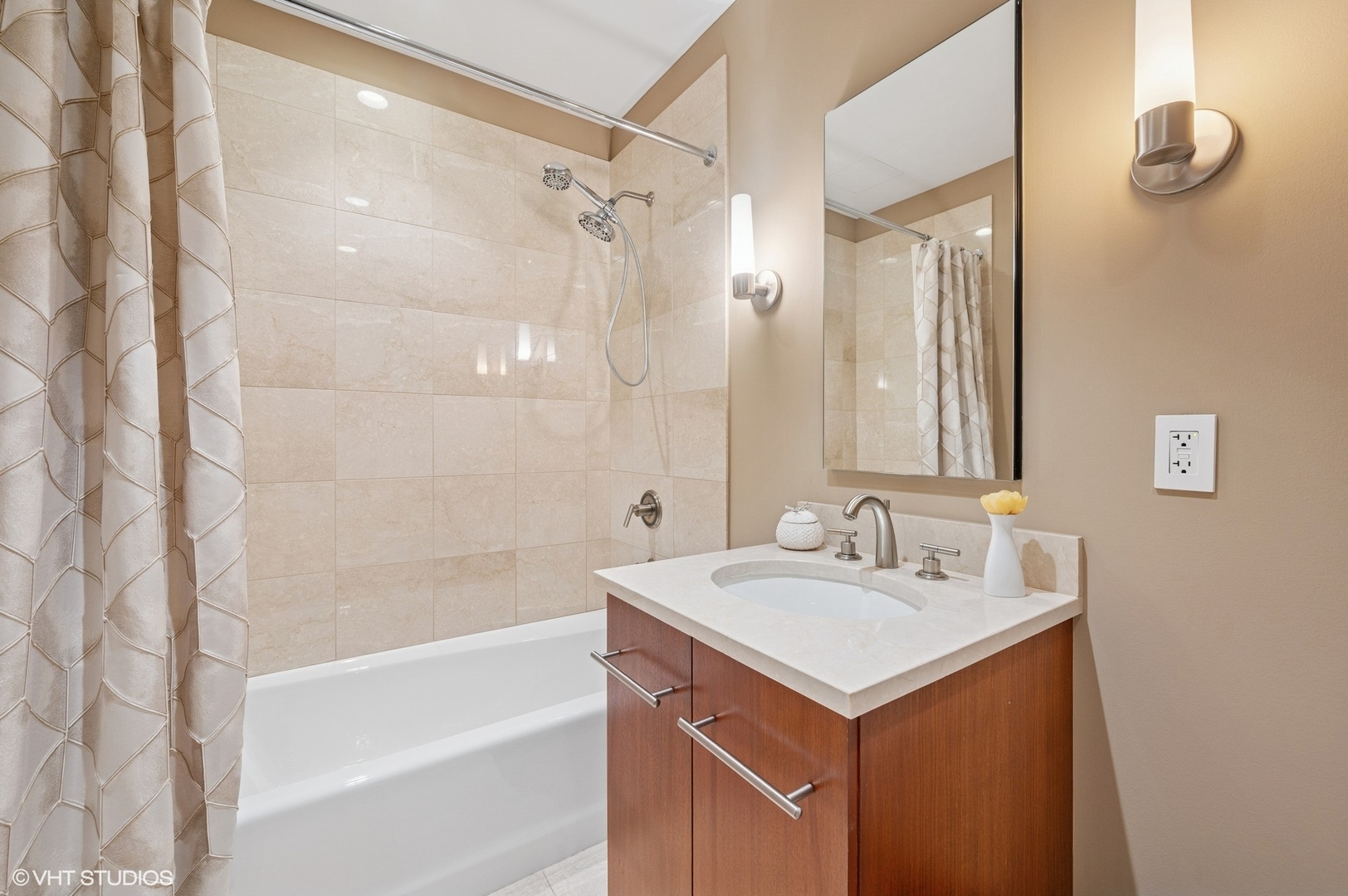 401 North Wabash Avenue, Unit 57F Chicago, IL 60611 - Photo 13 of 45 a bathroom with a sink and a mirror