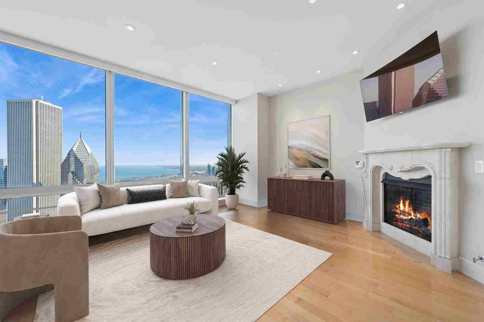 401 North Wabash Avenue, Unit 57F Chicago, IL 60611 - Photo 4 of 45 a living room with furniture and a fireplace