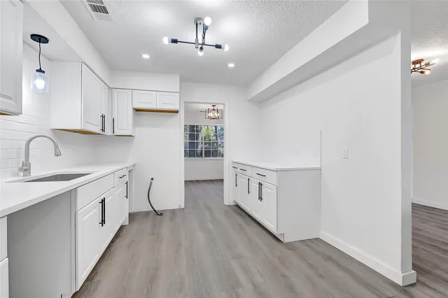 a view of a kitchen with electric appliances