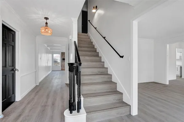 a view of entryway with wooden floor