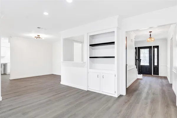 an empty room with wooden floor