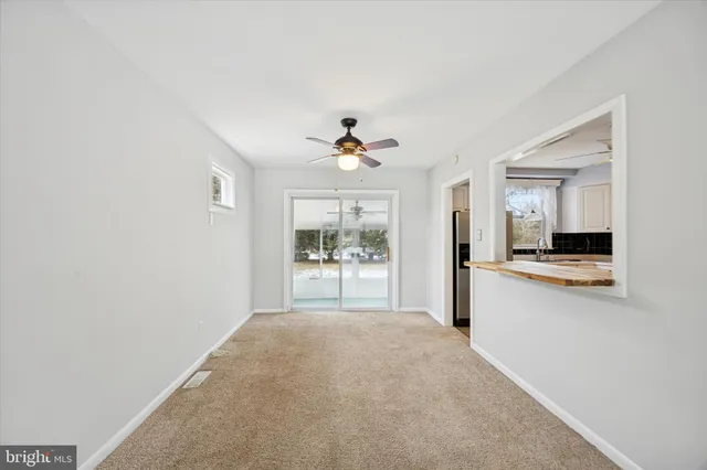 a view of a kitchen with a sink and a window
