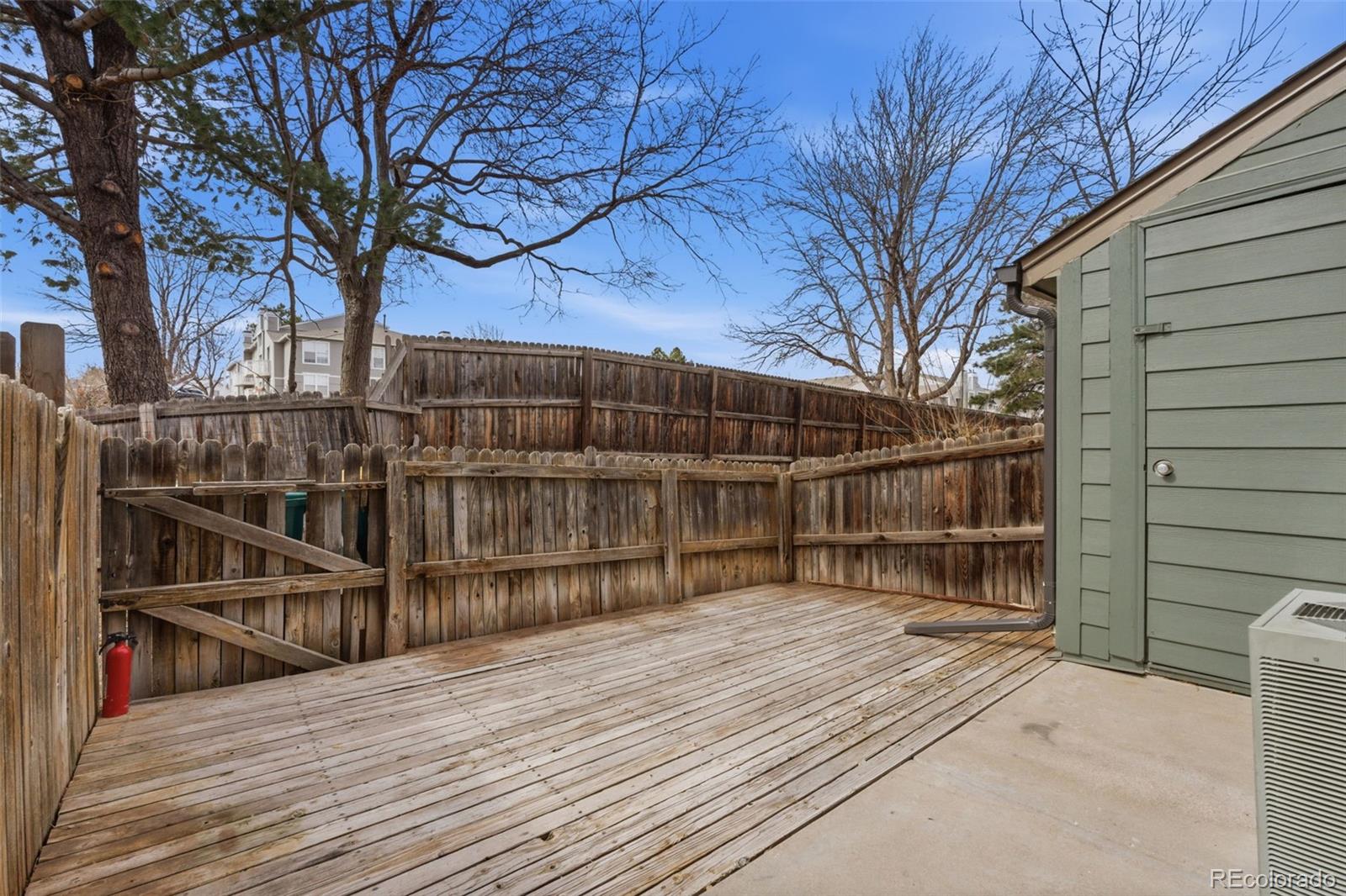 17335 East Rice Circle, Unit C Aurora, CO 80015 - Photo 12 of 14 a view of wooden deck with a trees
