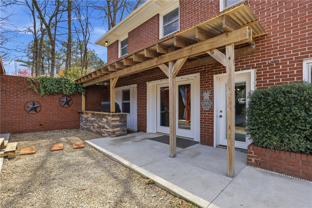 4304 Old Buncombe Road Greenville, SC 29617 - Photo 39 of 49 This inviting patio area offers a perfect spot for relaxation and outdoor entertaining.