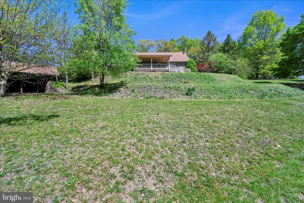 a backyard of a house with lots of green space