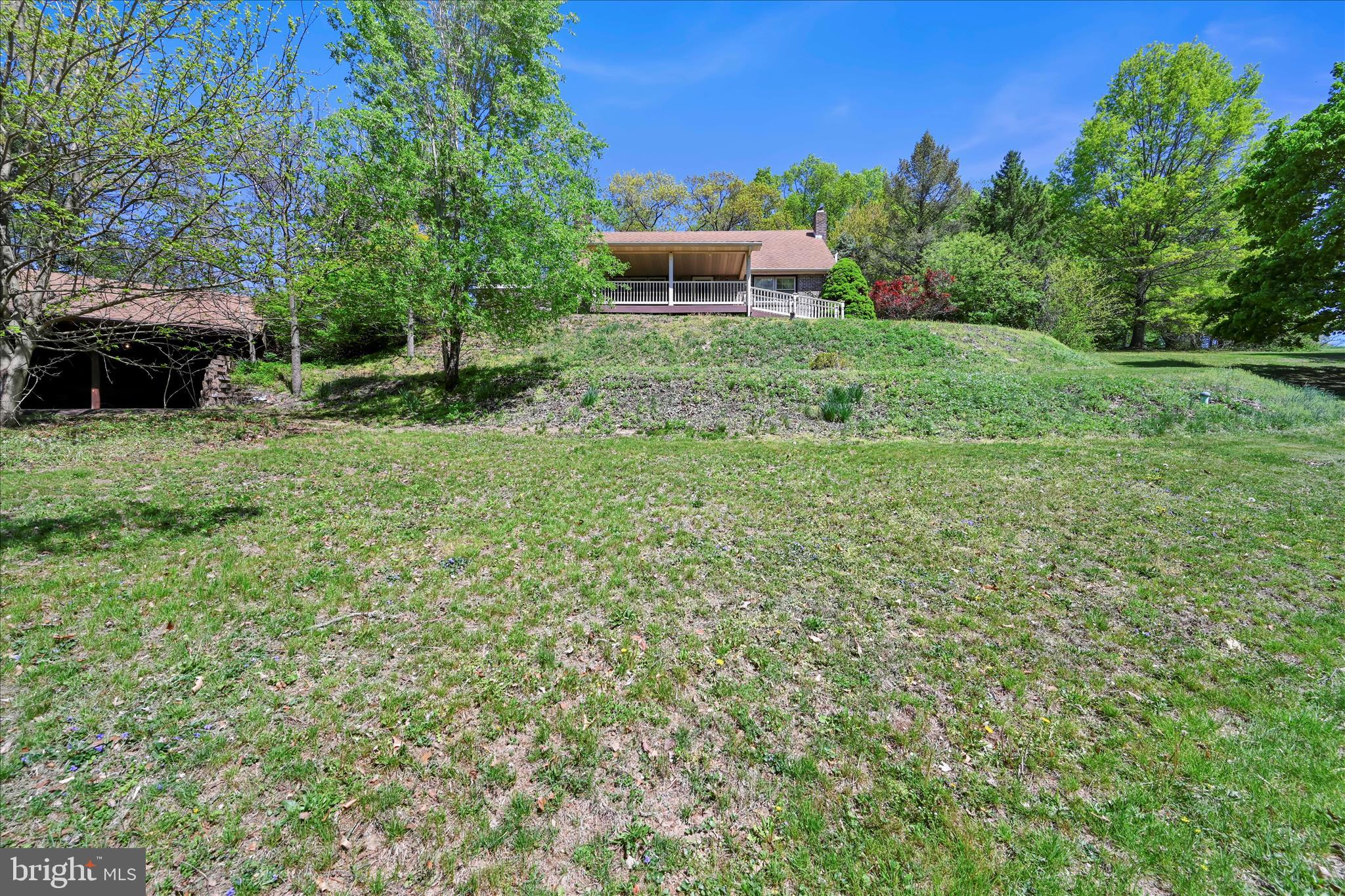 a backyard of a house with lots of green space