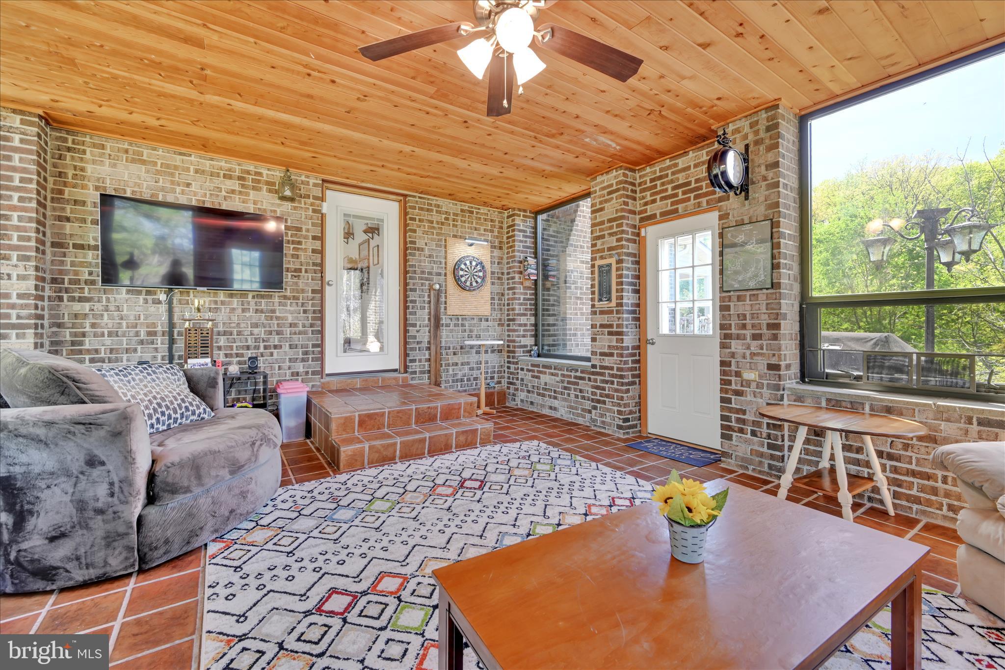 85 Gernants Church Road Leesport, PA 19533 - Photo 11 of 43 a living room with furniture and a flat screen tv