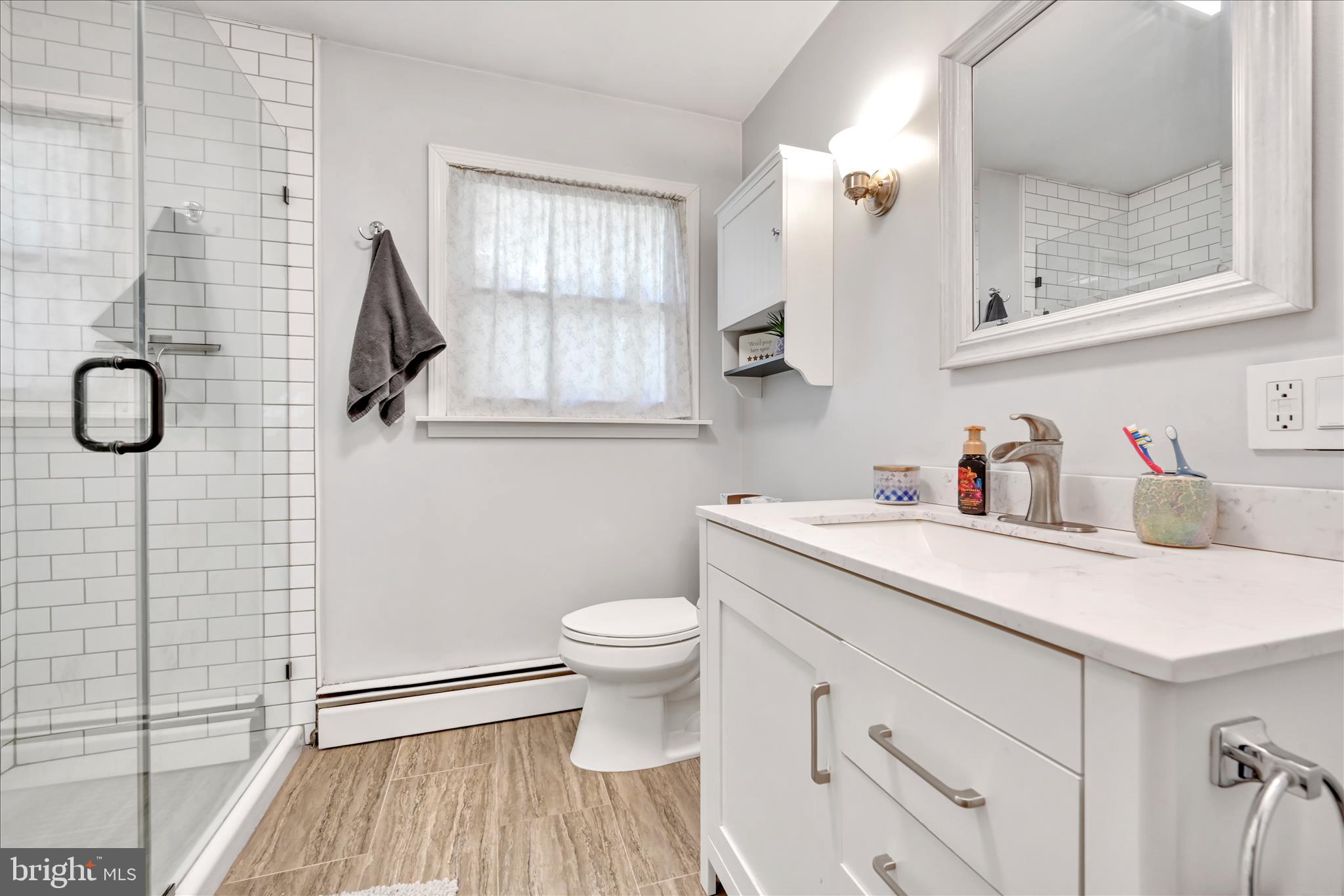85 Gernants Church Road Leesport, PA 19533 - Photo 14 of 43 a bathroom with a sink a toilet and a mirror