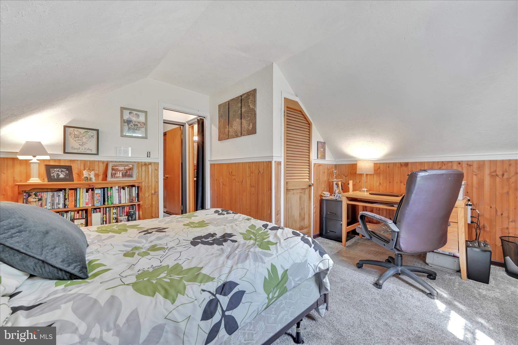 85 Gernants Church Road Leesport, PA 19533 - Photo 18 of 43 a bedroom with a bed a table and bookshelf