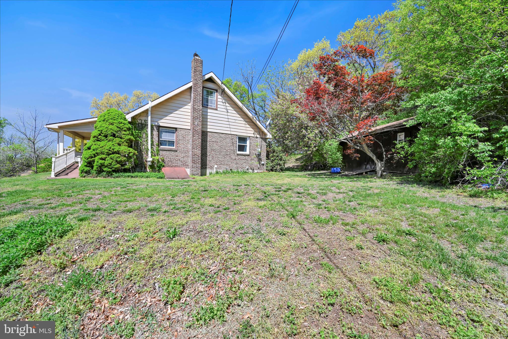 85 Gernants Church Road Leesport, PA 19533 - Photo 31 of 43 a backyard of a house with plants and large tree