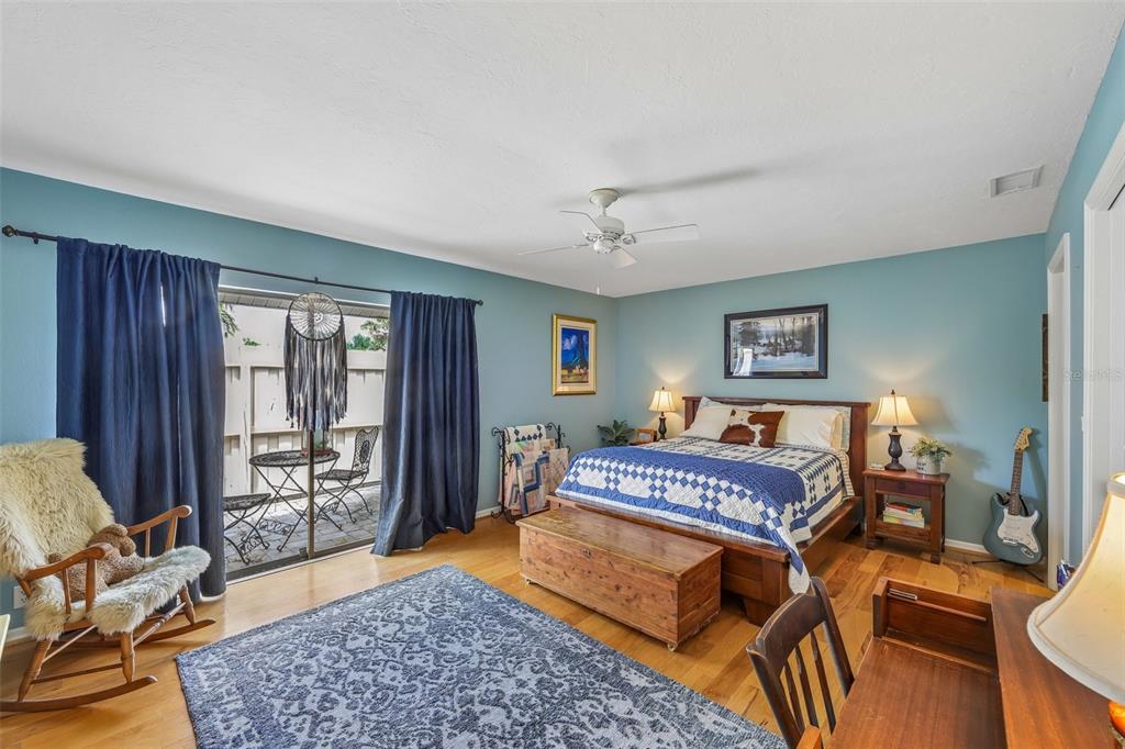 3757 Countryside Road Sarasota, FL 34233 - Photo 13 of 34 a bedroom with a bed and wooden floor