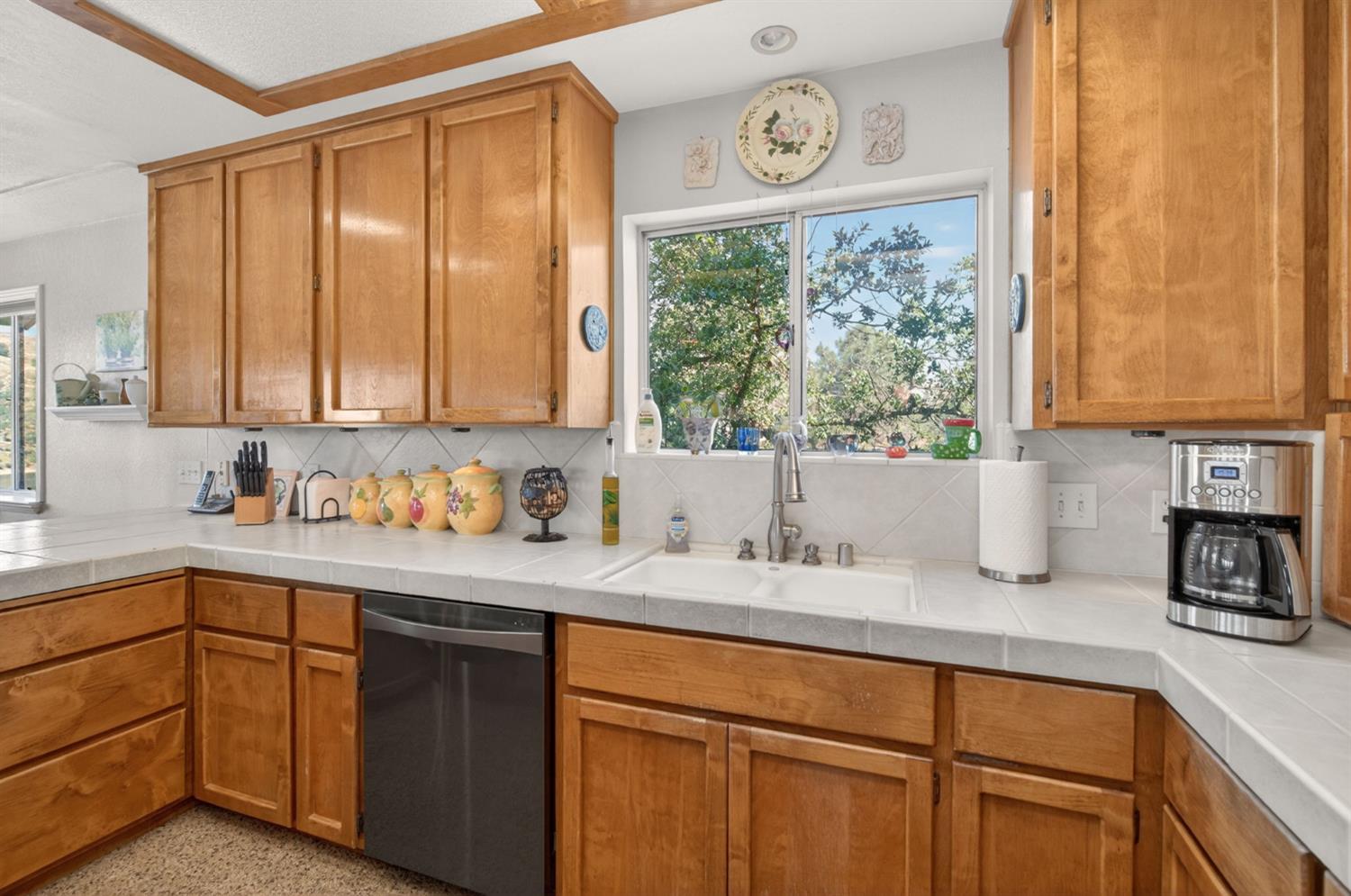 28037 Sky Harbour Road Friant, CA 93626 - Photo 10 of 40 a kitchen with a sink cabinets and window