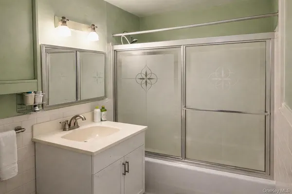 a bathroom with a sink and mirror