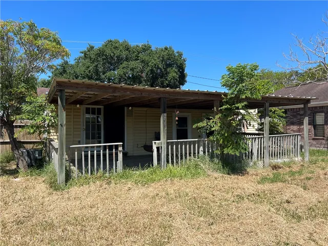 a house view with a garden space