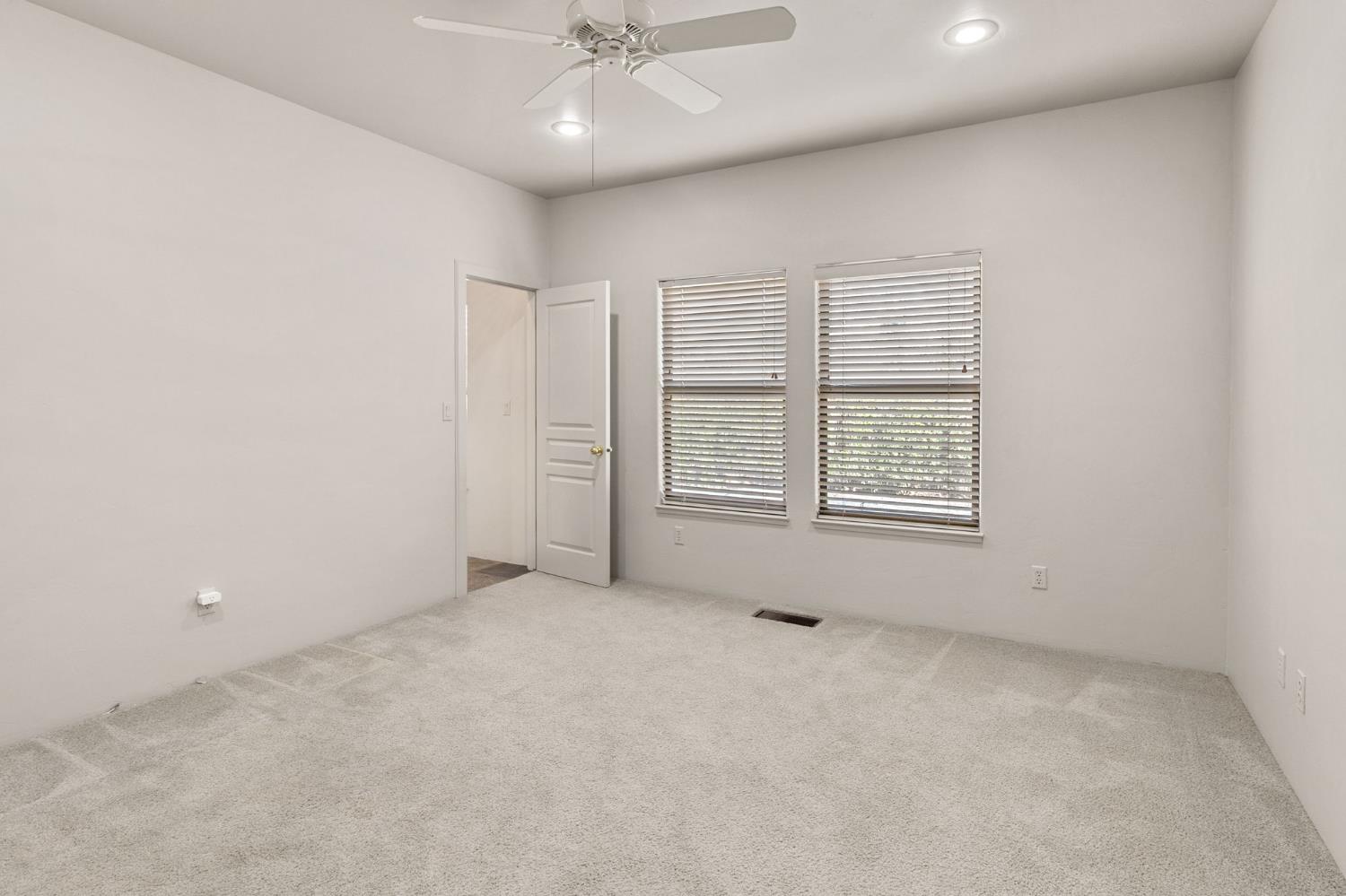 5724 Parker Road Modesto, CA 95357 - Photo 20 of 69 an empty room with windows and fan