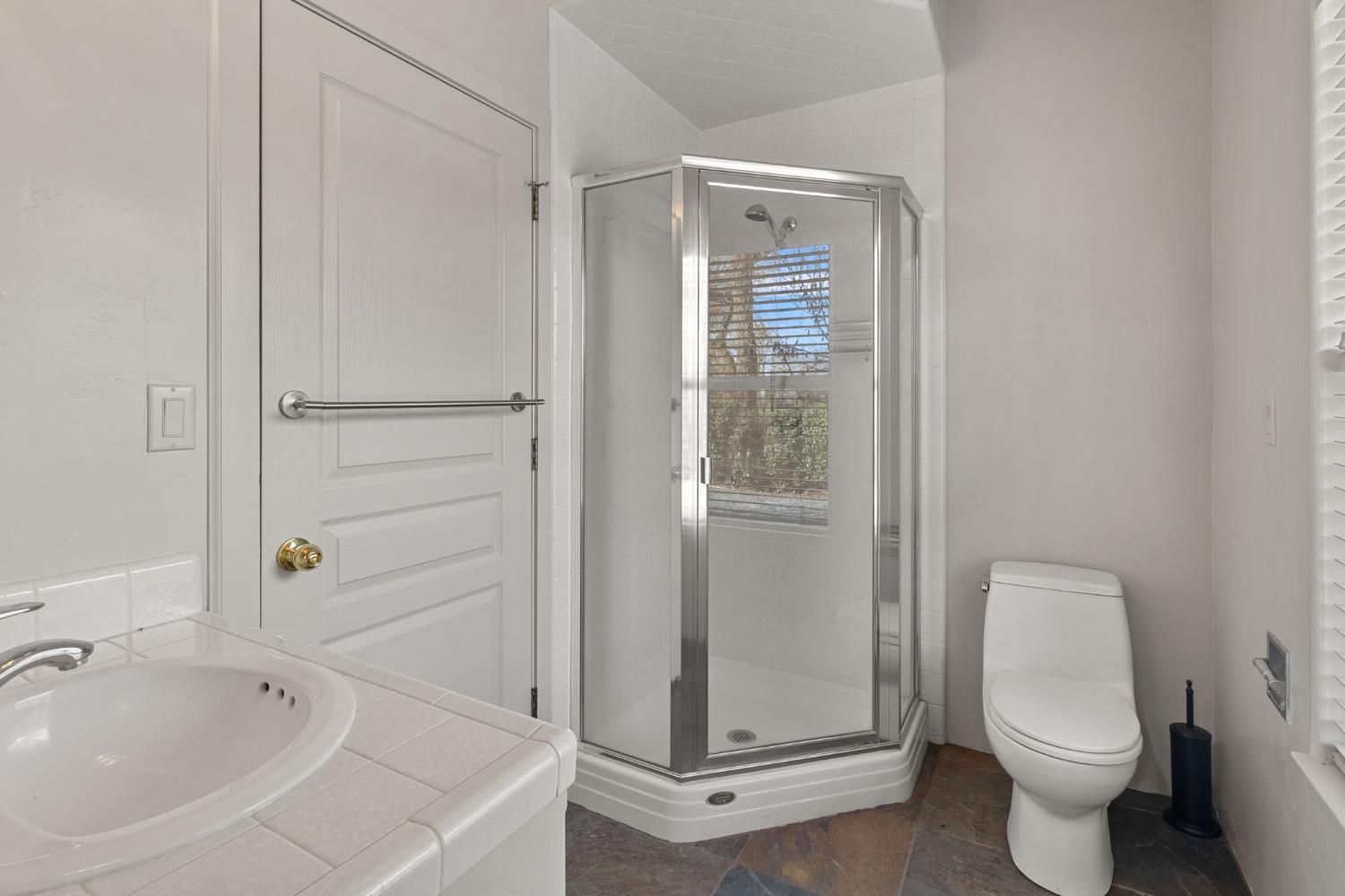 5724 Parker Road Modesto, CA 95357 - Photo 22 of 69 a bathroom with a toilet and shower
