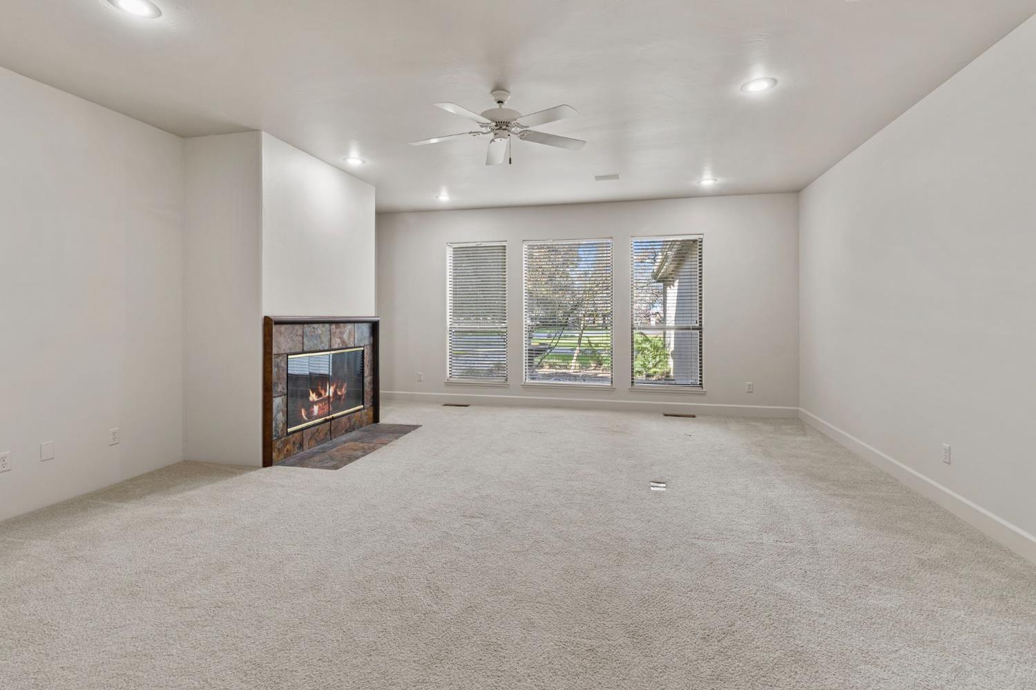 5724 Parker Road Modesto, CA 95357 - Photo 25 of 69 an empty room with windows and fireplace