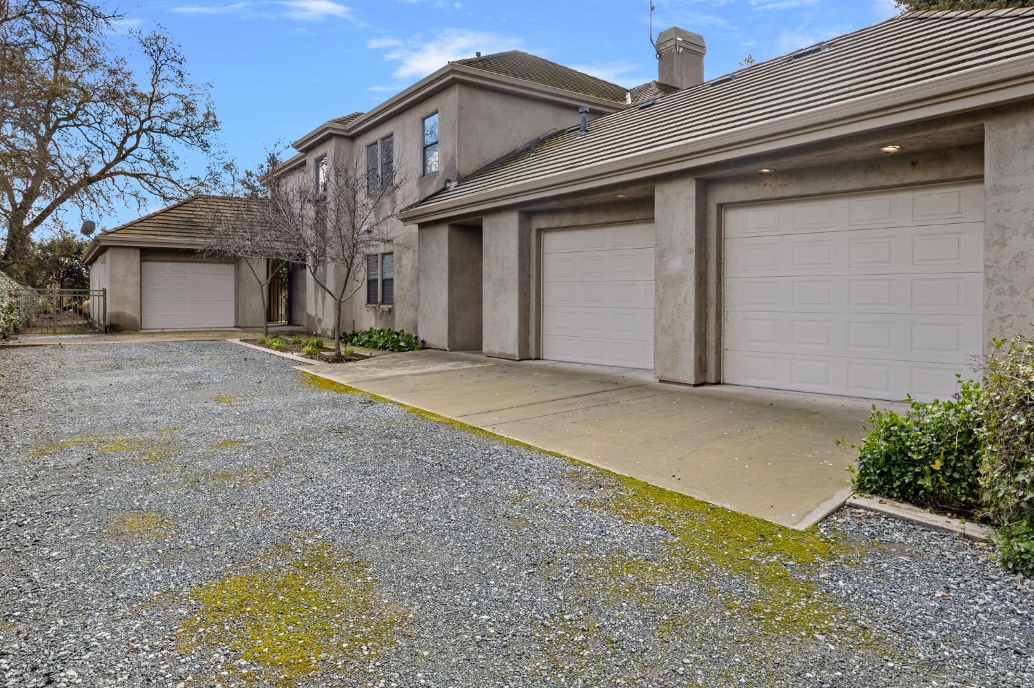 5724 Parker Road Modesto, CA 95357 - Photo 45 of 69 a front view of a house with a yard and garage