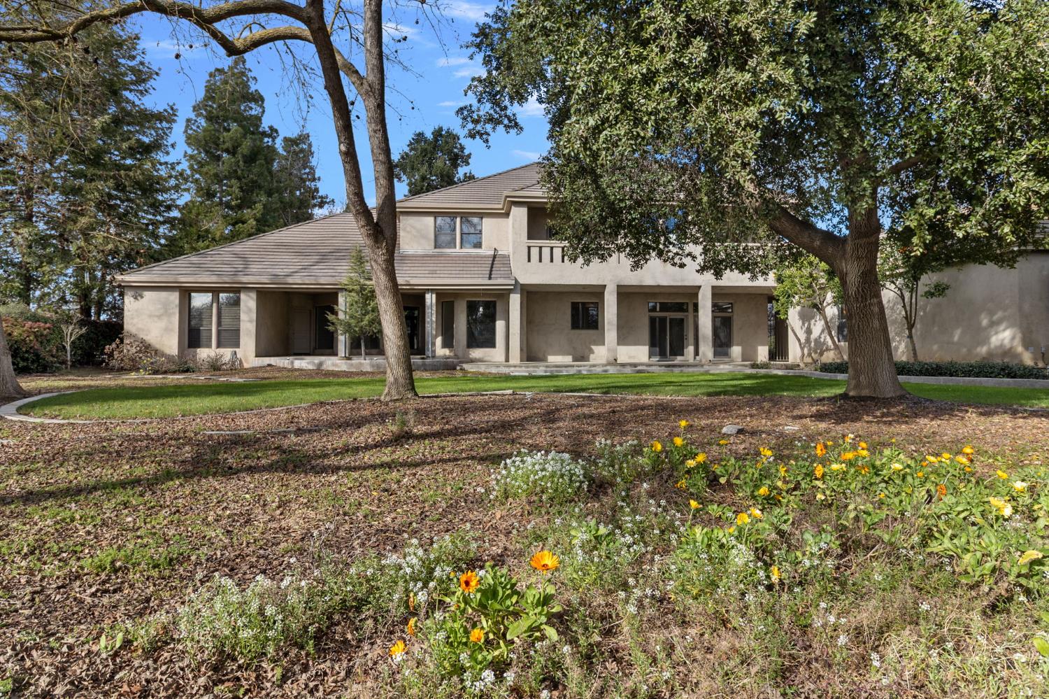 5724 Parker Road Modesto, CA 95357 - Photo 5 of 69 a front view of a house with a garden