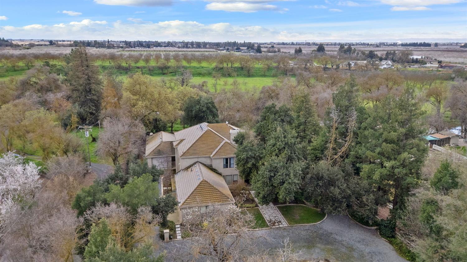 5724 Parker Road Modesto, CA 95357 - Photo 55 of 69 an aerial view of a house with a lake view