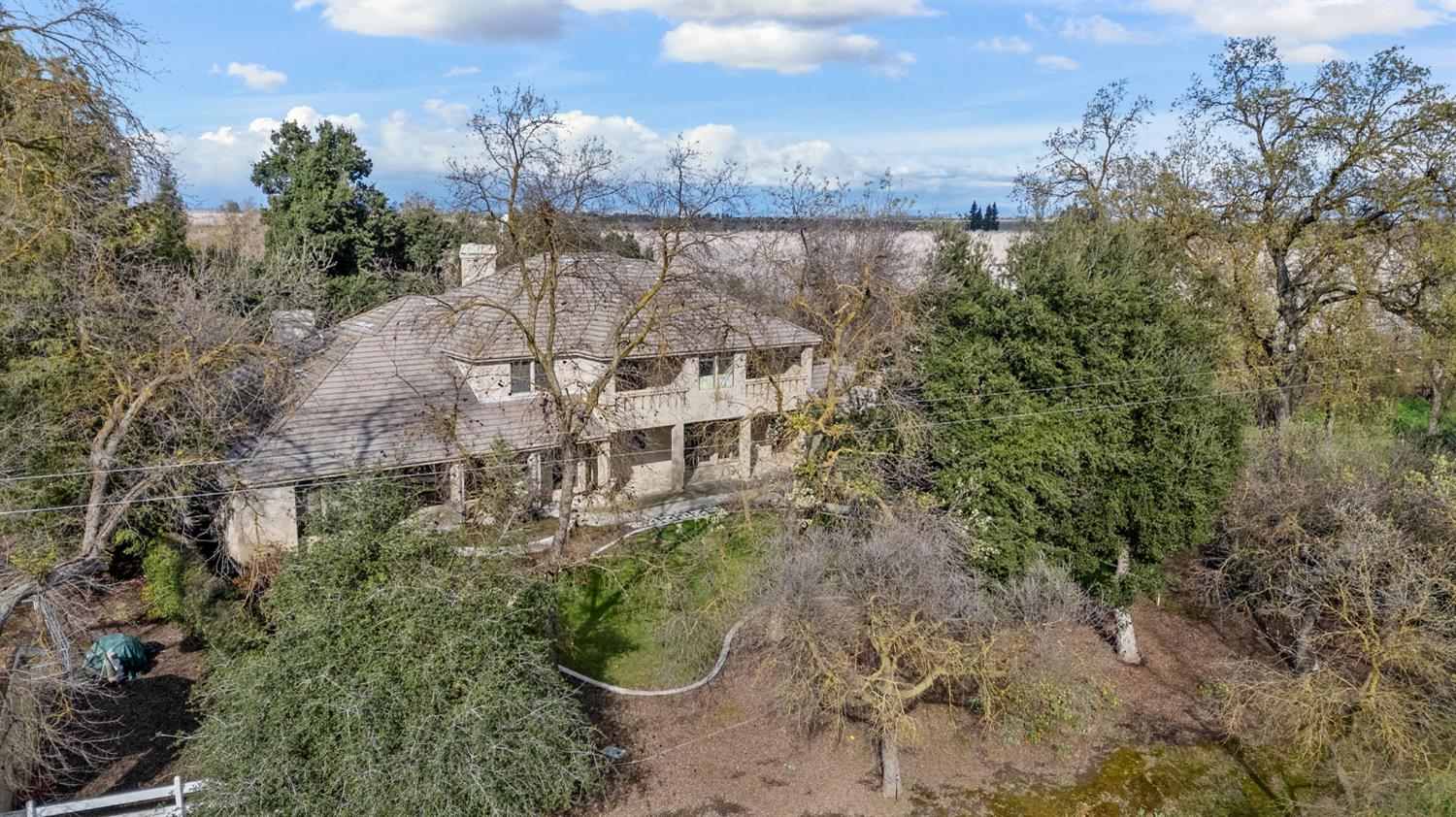 5724 Parker Road Modesto, CA 95357 - Photo 64 of 69 a aerial view of a house with a yard and lake view