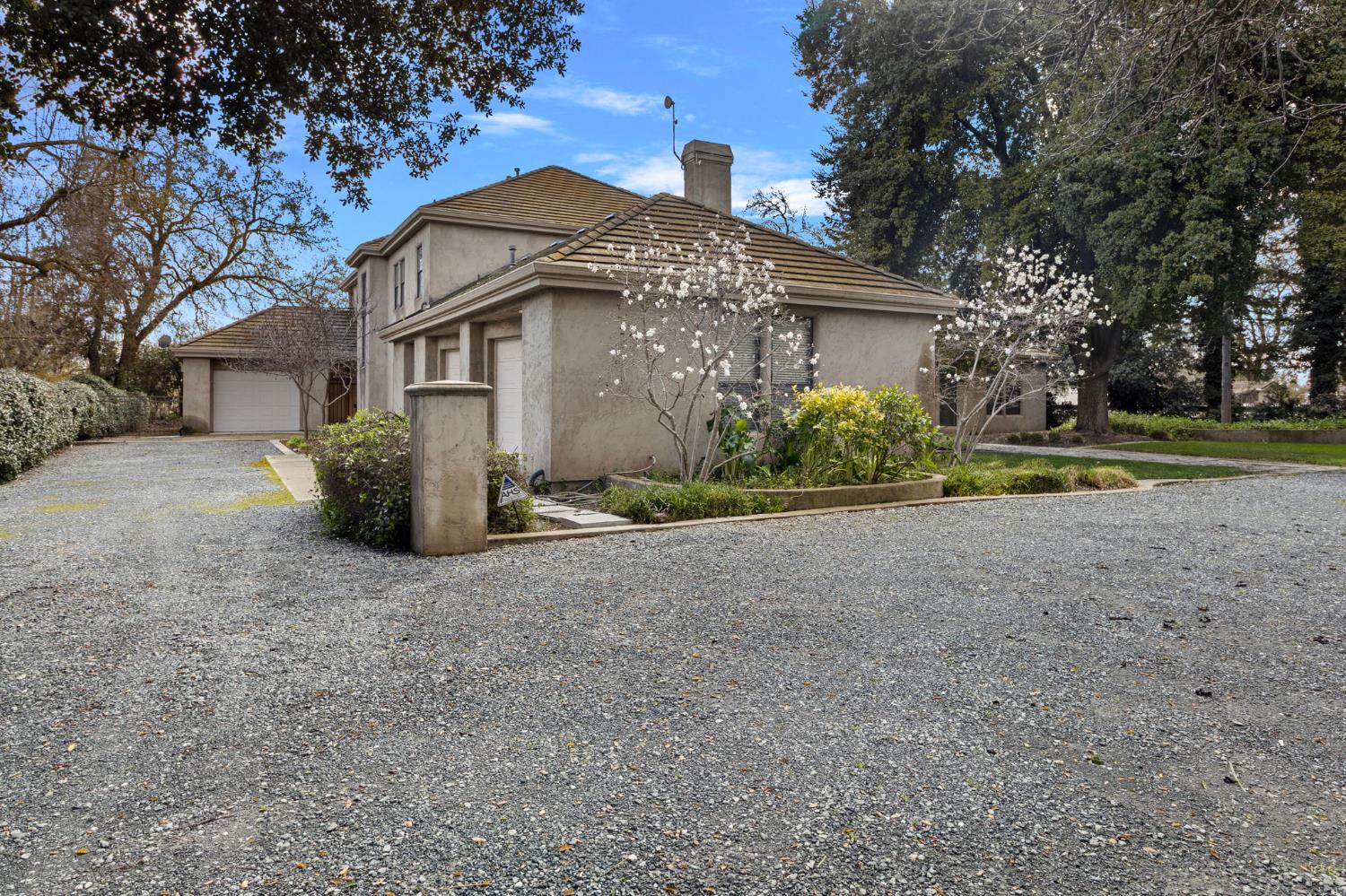 5724 Parker Road Modesto, CA 95357 - Photo 7 of 69 a front view of a house with a yard and garage