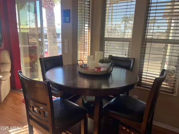 a view of a dining room with furniture and window