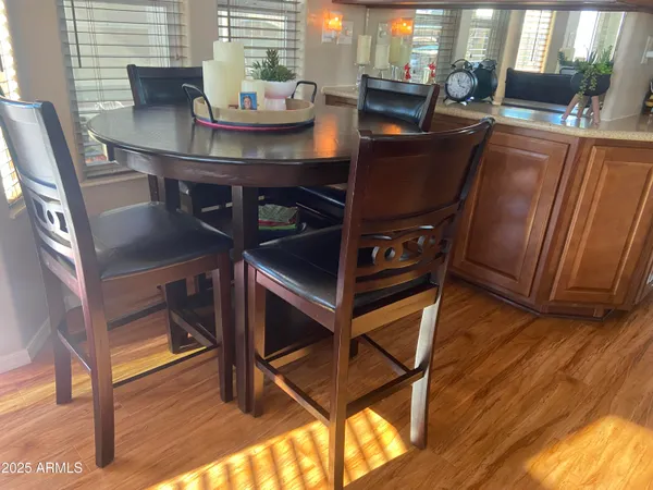 a view of a dining room with furniture and wooden floor