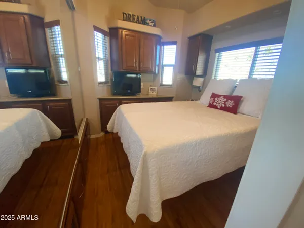 a spacious bedroom with a bed and window