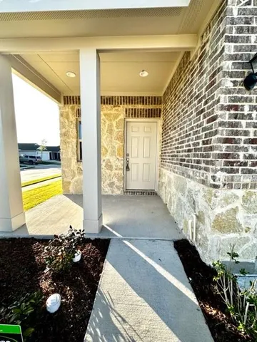 a view of a living room and a floor to ceiling window