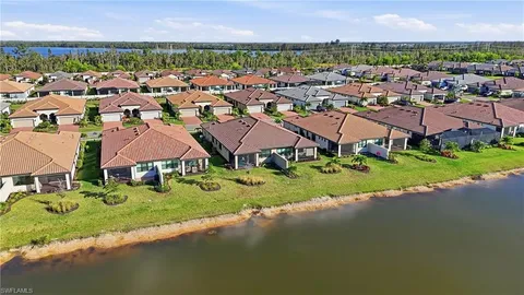 an aerial view of residential house with outdoor space and a swimming pool