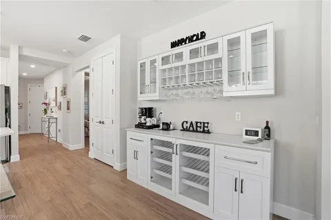 a kitchen with stainless steel appliances a sink and cabinets