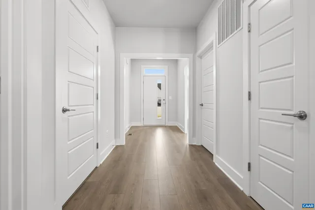 a view of gallery with wooden floor