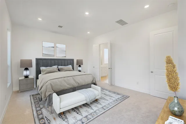 a bedroom with a bed and a painting on the wall