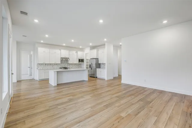 a view of kitchen with wooden floor and kitchen