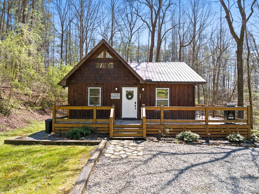 941 Hidden Valley Drive Morganton, GA 30560 - Photo 1 of 35 a front view of a house with garden