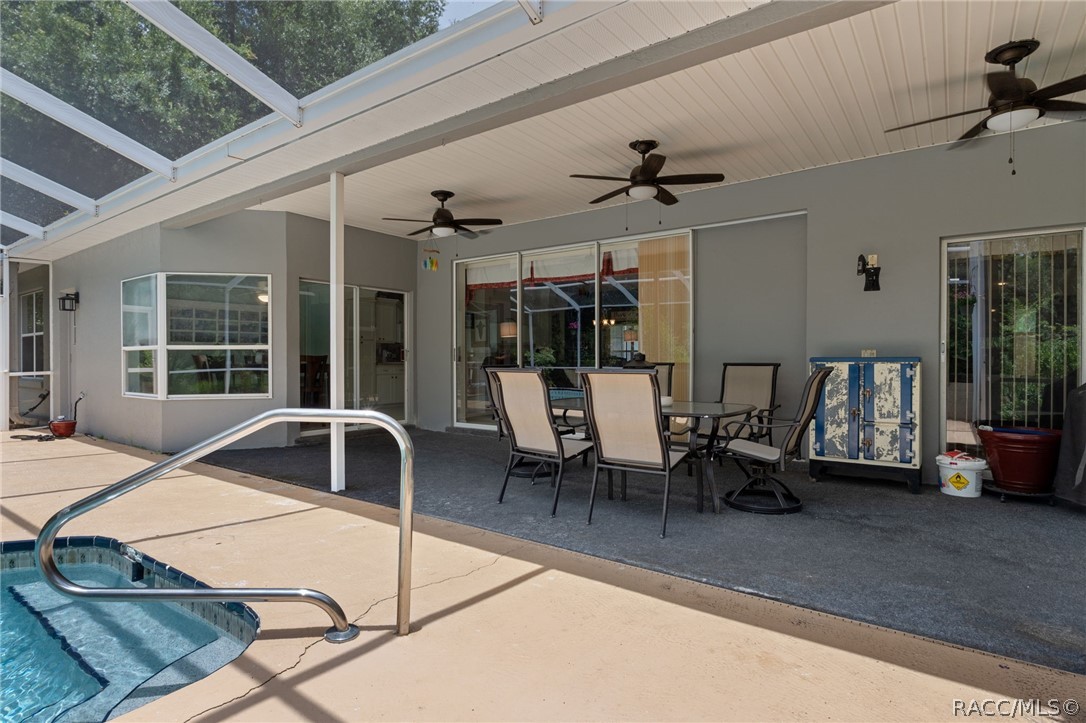 2460 West Pine Ridge Boulevard Beverly Hills, FL 34465 - Photo 8 of 47 a view of a dining room with furniture window and outside view