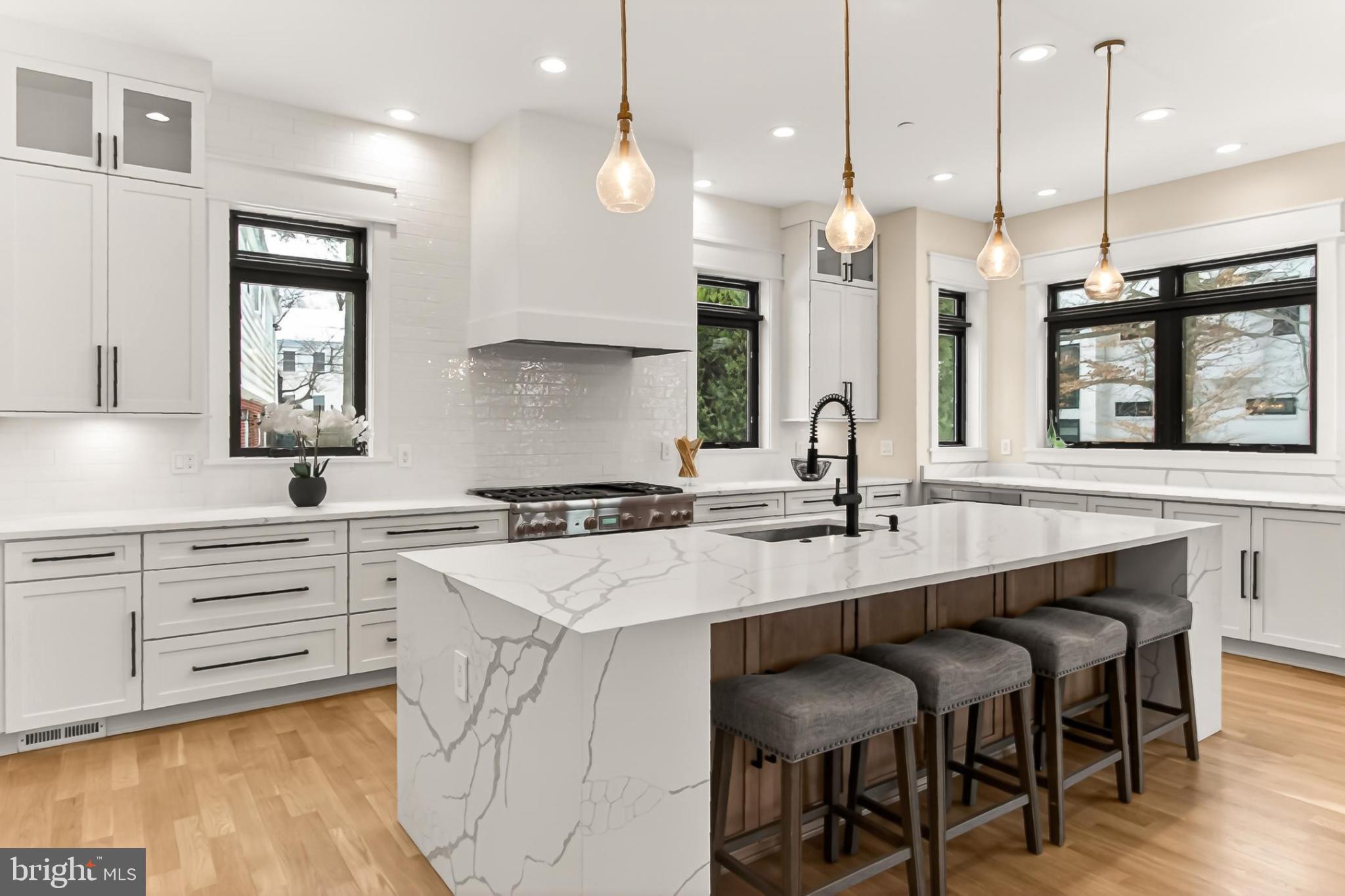 7604 Hemlock Street Bethesda, MD 20817 - Photo 26 of 85 Sleek modern kitchen with elegant finishes.