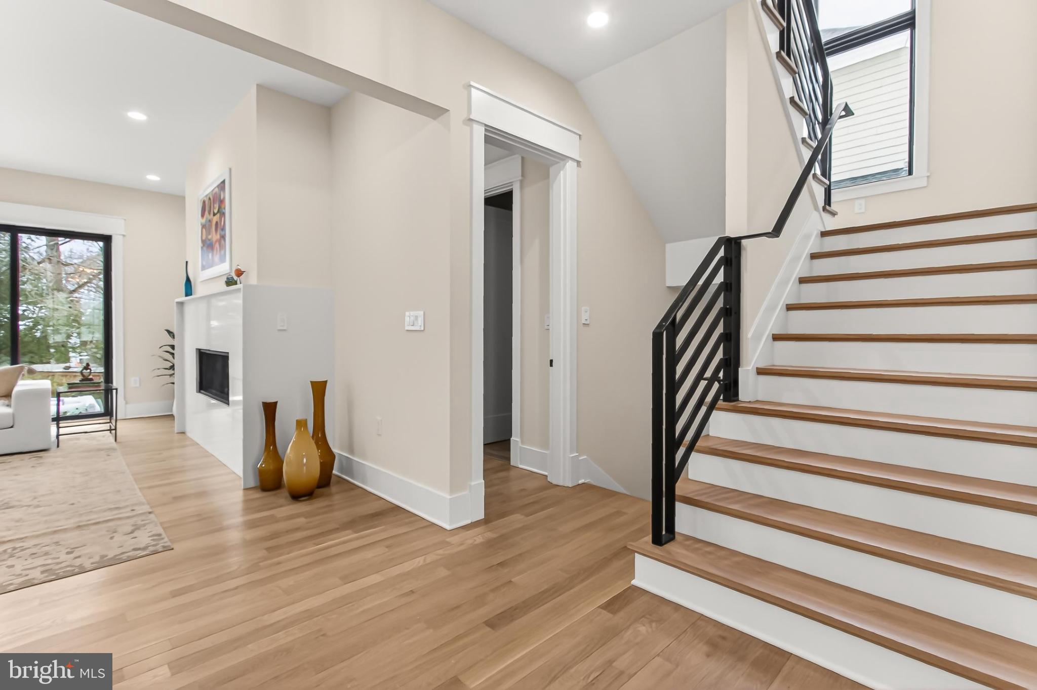7604 Hemlock Street Bethesda, MD 20817 - Photo 41 of 85 a view of entryway with wooden floor and stairs