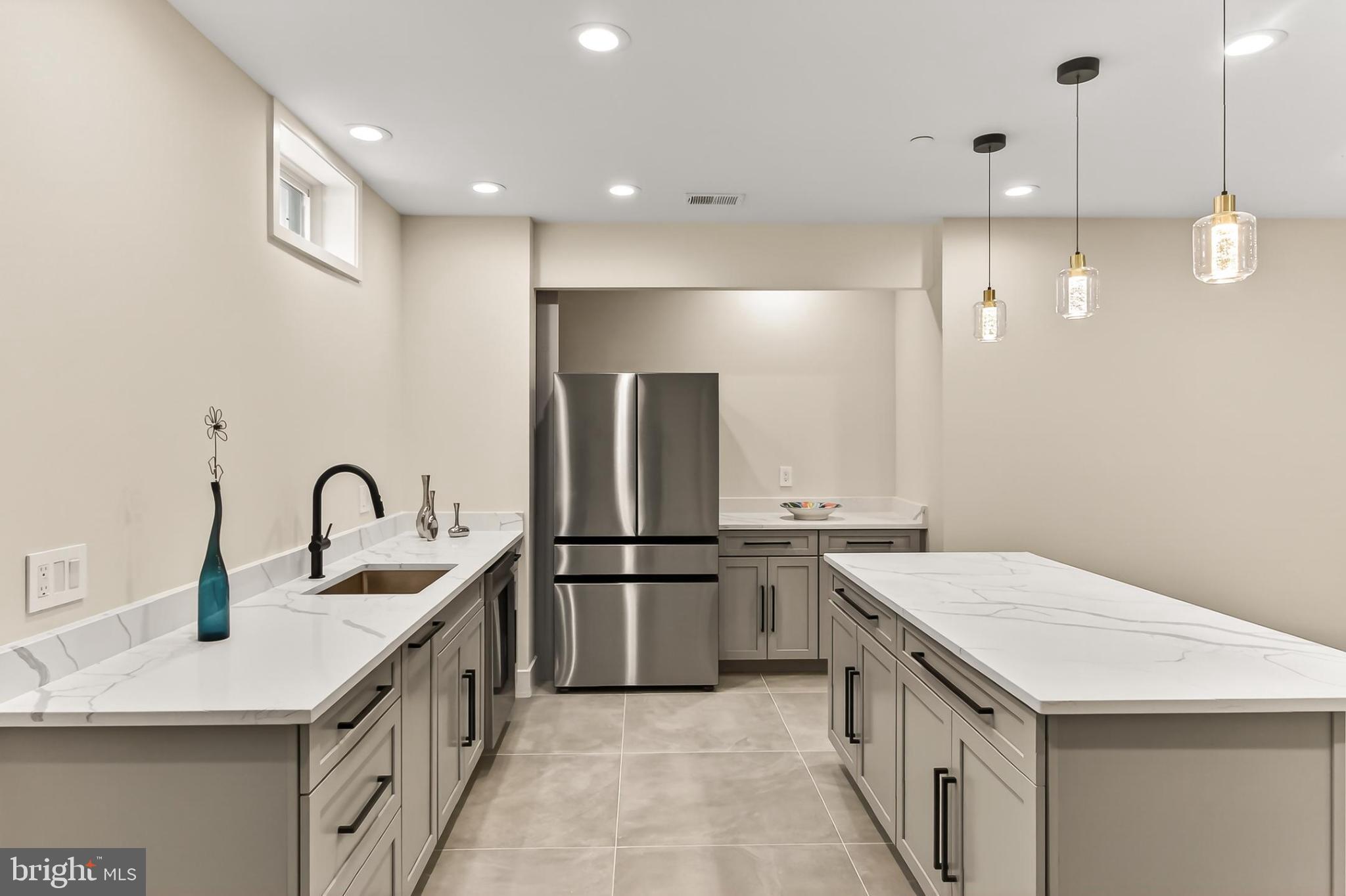 7604 Hemlock Street Bethesda, MD 20817 - Photo 72 of 85 Sleek modern kitchen with elegant finishes.