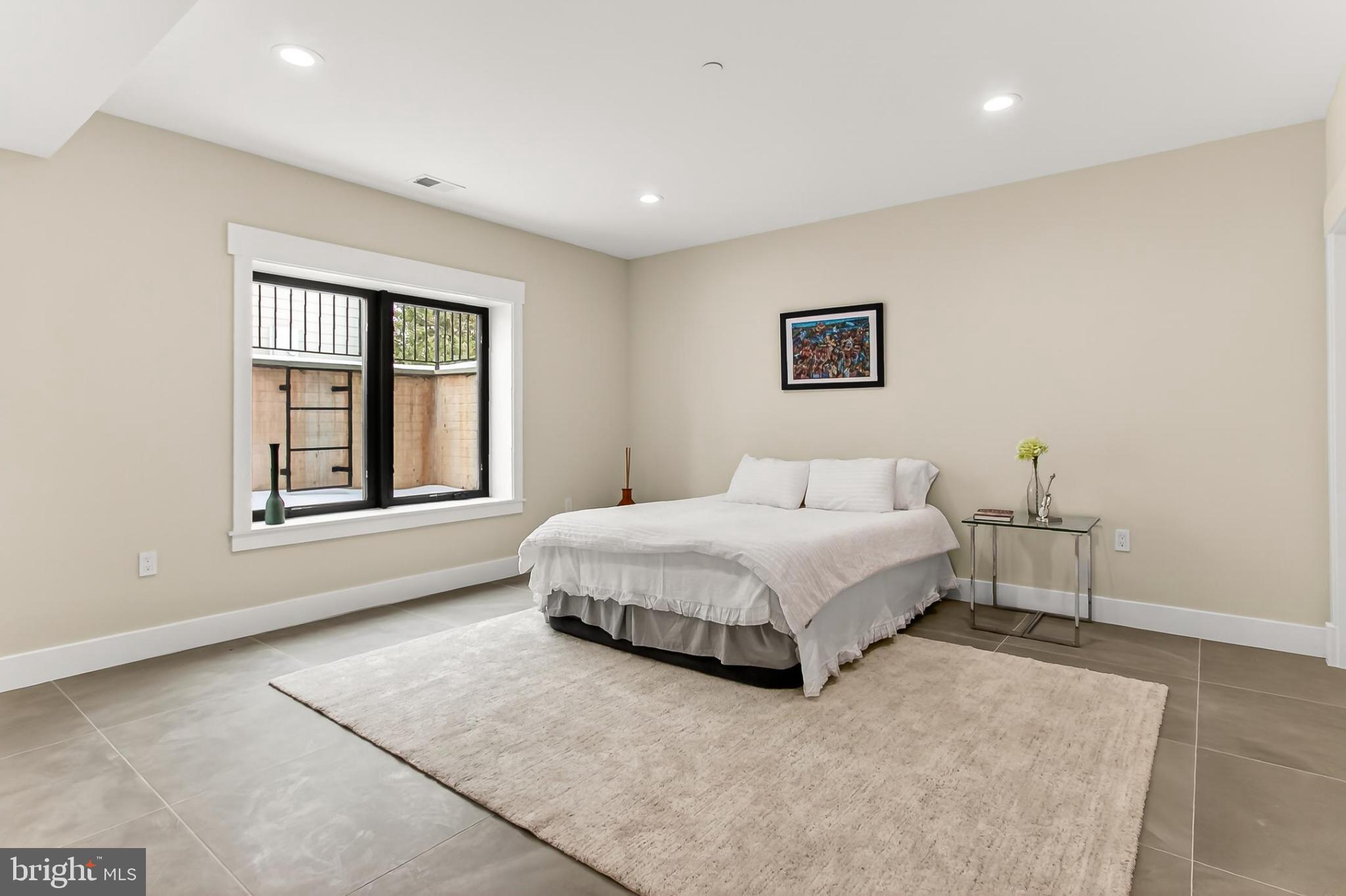 7604 Hemlock Street Bethesda, MD 20817 - Photo 74 of 85 a spacious bedroom with a bed and a window